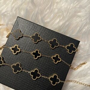 Elegant Black and Gold Clover Bracelet